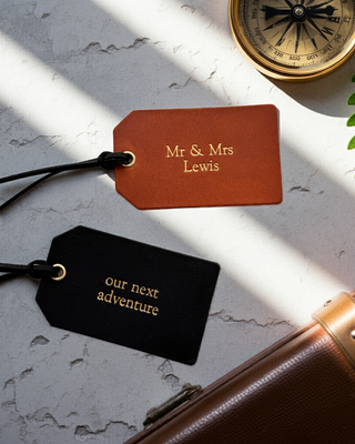 Black and tan leather luggage tags