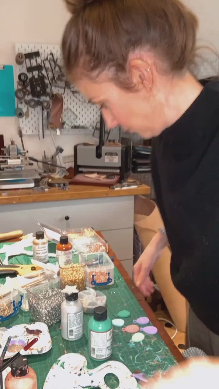 Me in my studio making glass charms and coasters