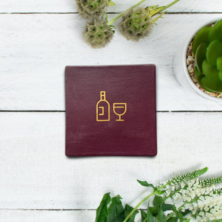 Burgundy square coaster with wine graphic symbol