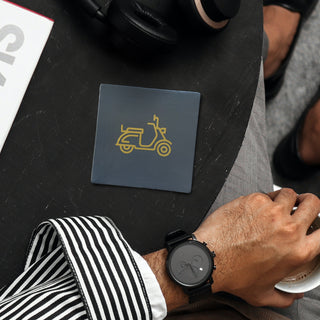 An icon symbol of Italian style. This Vespa coaster is chic and effective in its simple graphic styling. A tasteful gift.